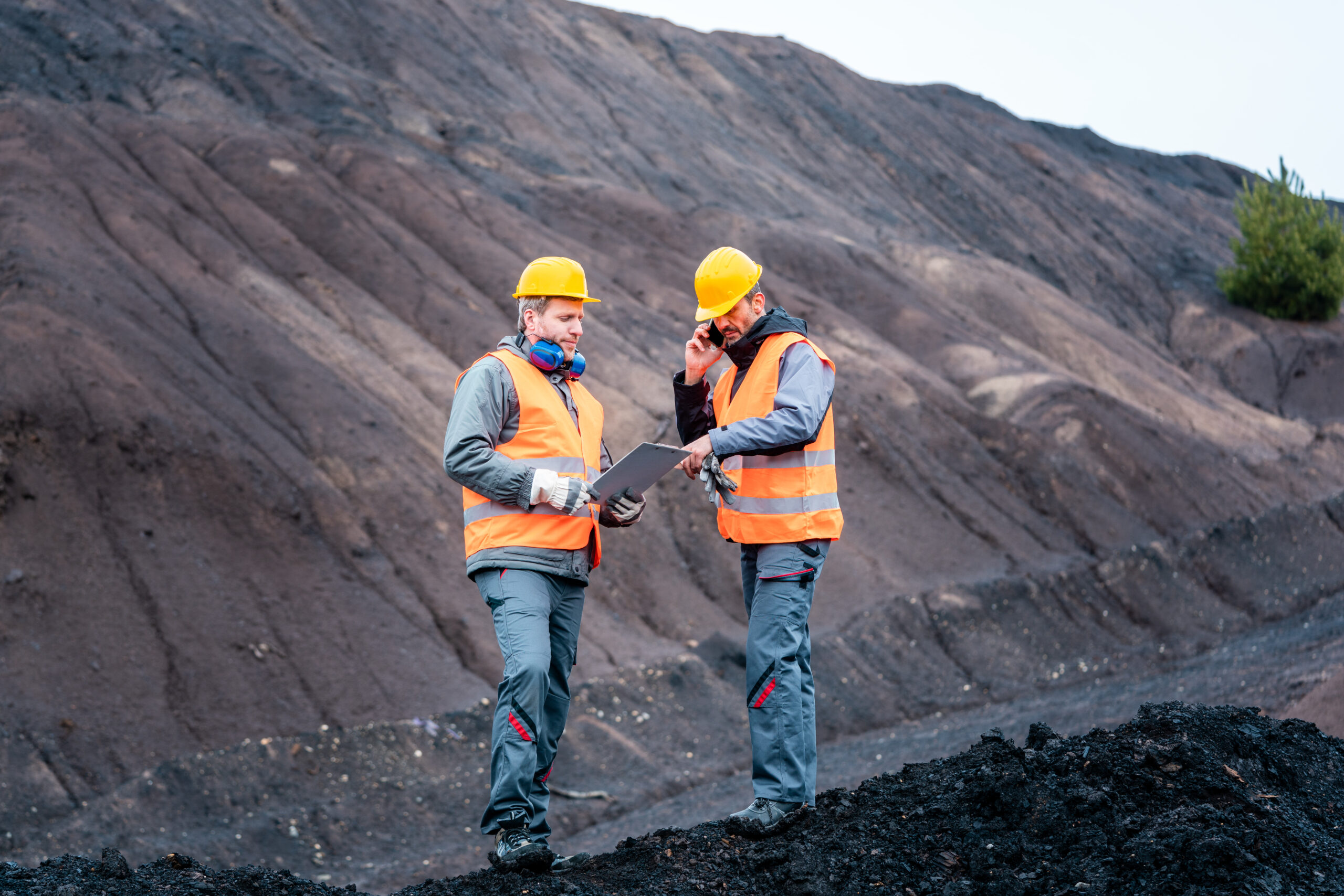 Workers,Standing,In,Open-cast,Mining,Operation,Pit